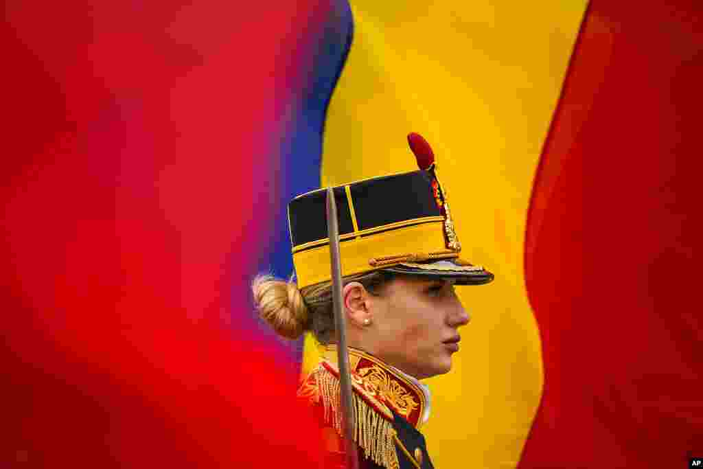 A honor guard soldier stands at attention during a memorial religious service for those killed in the 1989 anti-communist uprising in University Square, in Bucharest, Romania. Participants and relatives of those killed marked the 33rd anniversary of the anti-communist uprising which started in Bucharest on Dec. 21, 1989, and left more than one thousand people dead and ended the rule of dictator Nicolae Ceausescu.