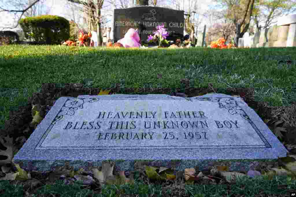 The grave of a unidentified small boy is seen in a cemetery in Philadelphia, Pennsylvania. His beaten naked body was found abandoned in a cardboard box decades ago.