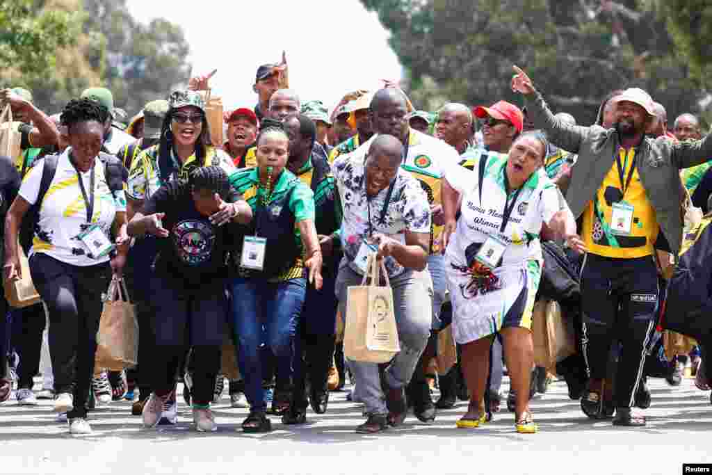 Delegates sing and chant slogans as they arrive for the 55th National Conference of the ruling African National Congress (ANC) at the Nasrec Expo Centre in Johannesburg, South Africa.