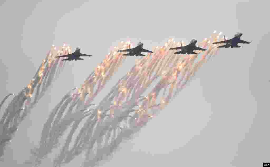 Su-30MK2 fighter jets of Vietnam People's Army Air Force fly during the Vietnam 2022 International Defense Expo in Hanoi.