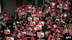  Protesters hold placards and shout slogans in Istanbul on April 26, 2022 during a rally in support of civil society leader Osman Kavala, who was sentenced to life in prison the previous day on controversial charges of trying to topple the government. (Yasin Akgul/AFP)