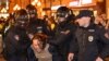 Police officers detain a man in Moscow on September 21, 2022, following calls to protest against a partial mobilization announced by President Vladimir Putin, after Russia's invasion of Ukraine earlier that year. (Alexander Nemenov/AFP)