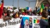 Malians demonstrate against France and in support of Russia on the 60th anniversary of the independence of the Republic of Mali in Bamako on September 22, 2020. The banner in French reads: "Putin, the road to the future". (AP) 