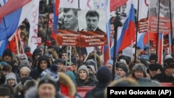 Ksenia Sobchak, centre bottom, attends a rally in memory of opposition leader Boris Nemtsov, Moscow, February 25, 2018.