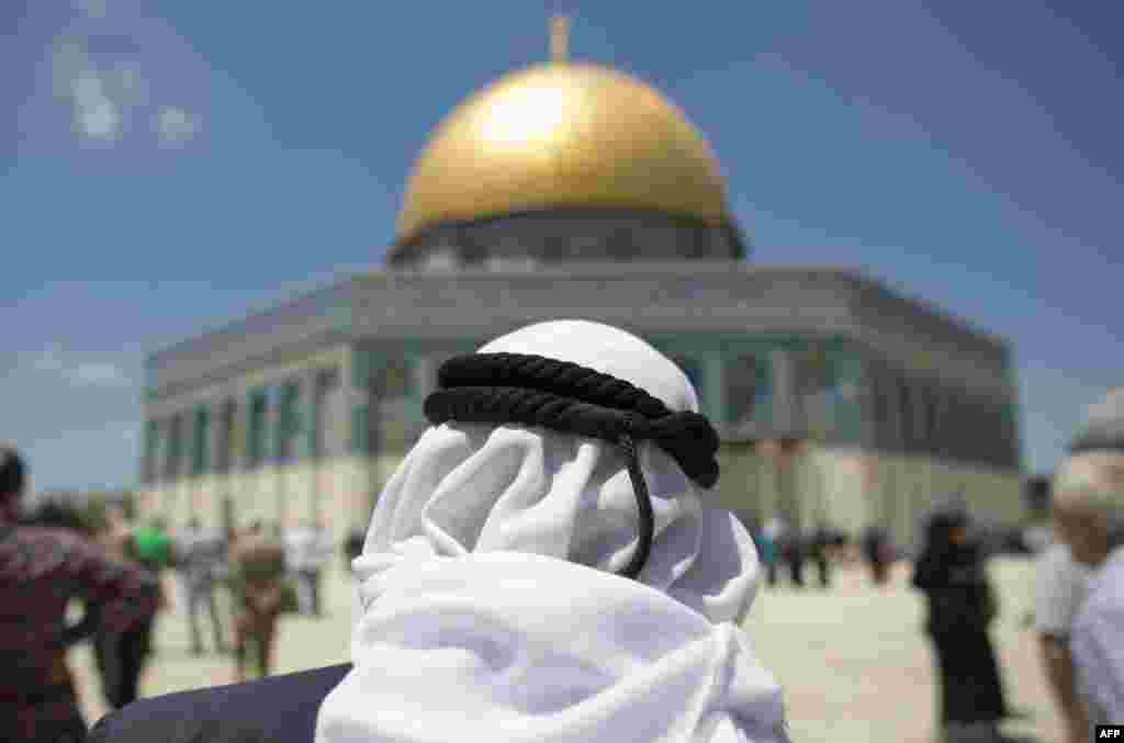 Palestinian Muslim worshipers walk in Jerusalem's Al-Aqsa mosque compound following Friday prayers in Jerusalem's Old City, Israel.
