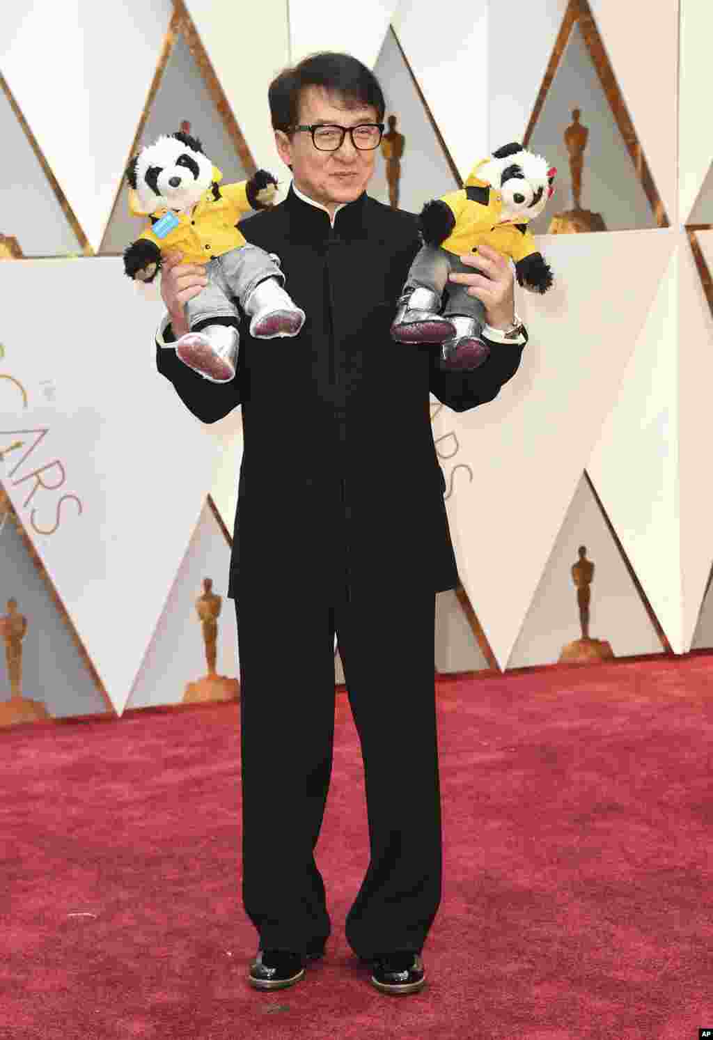 Jackie Chan arrives at the Oscars on Sunday, Feb. 26, 2017, at the Dolby Theatre in Los Angeles.