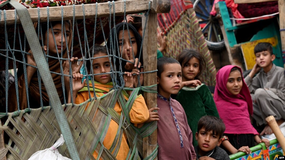 Afghan children refugees arrive on trucks from Pakistan at the Afghanistan-Pakistan Torkham border in Nangarhar province on Nov. 1, 2023.