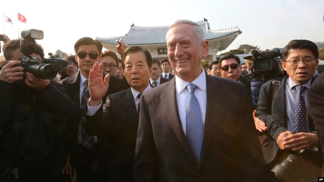 U.S. Defense Secretary Jim Mattis, center right, walks with South Korean Defense Minister Han Min Koo, center left, to meet Korean War veterans at the National Cemetery in Seoul, South Korea, Feb. 3, 2017.