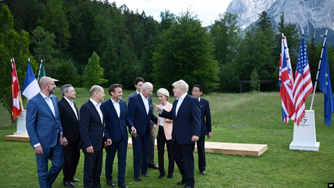 Britain's Prime Minister Boris Johnson, second right, speaks with from left, European Council President Charles Michel, Italy's Prime Minister Mario Draghi, Germany's Chancellor Olaf Scholz, France's President Emmanuel Macron, US President Joe Biden, Eur