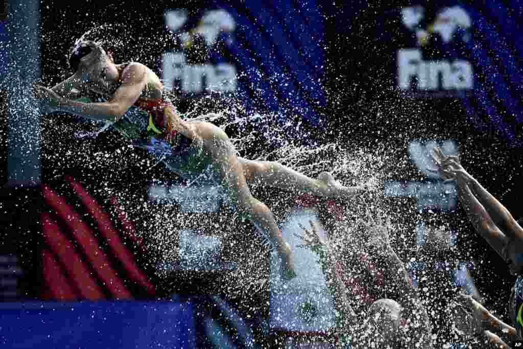 Team Japan competes during the final of the free combination of artistic swimming at the 19th FINA World Championships in Budapest, Hungary.