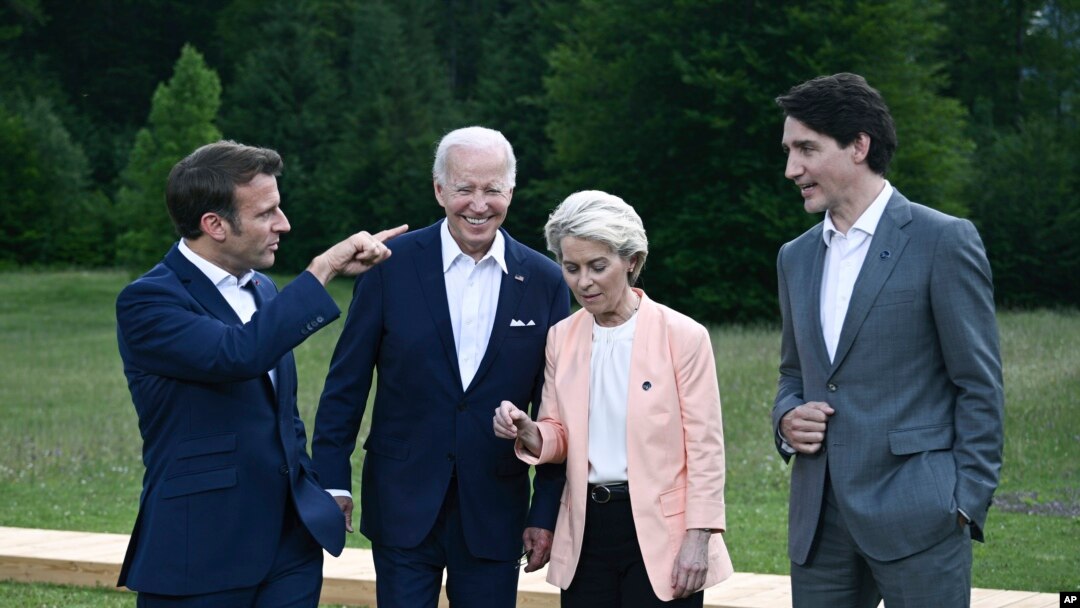 From left, President Emmanuel Macron, US President Joe Biden, European Commission President Ursula von der Leyen and Canada's Prime Minister Justin Trudeau leave after posing for a group photo , during the G7 Summit, at Castle Elmau in Kruen, near Garmisc