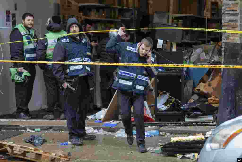 Responders work to clean up the scene of Tuesday's shooting that left multiple people dead at a kosher market in Jersey City, New Jersey.