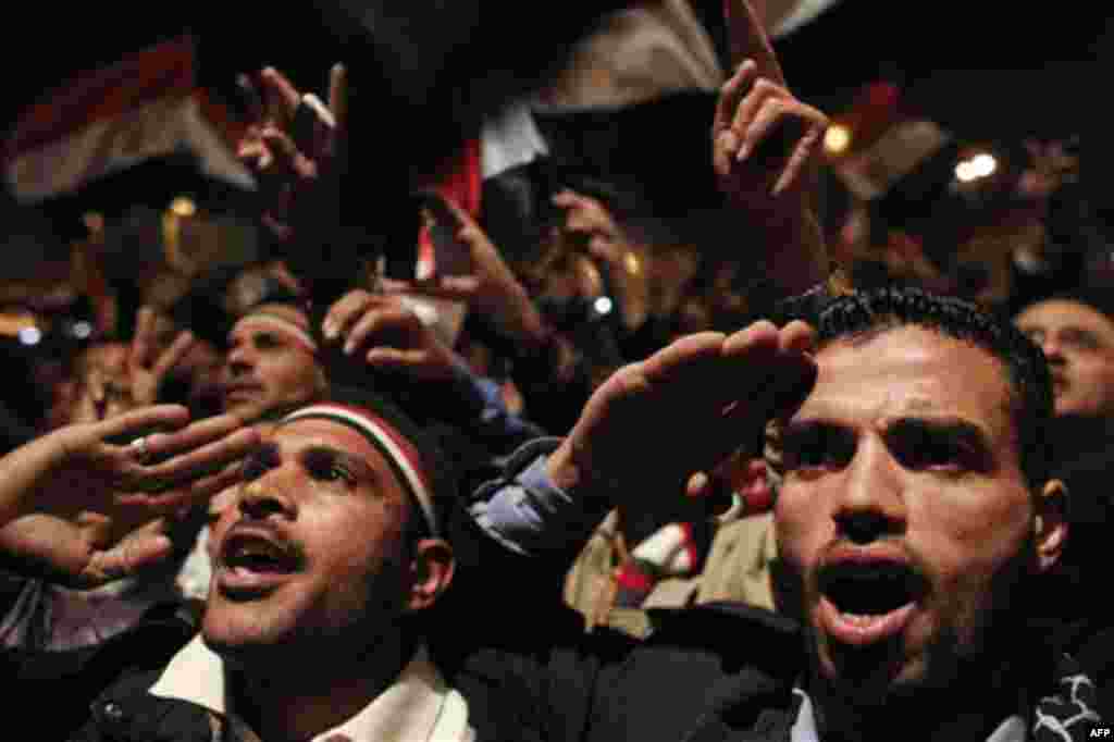Anti-government protesters demonstrate prior to the televised speech of Egyptian President Hosni Mubarak, in which they believed he would step down, at the continuing anti-government demonstration in Cairo, Egypt Thursday, Feb. 10, 2011. Mubarak refused