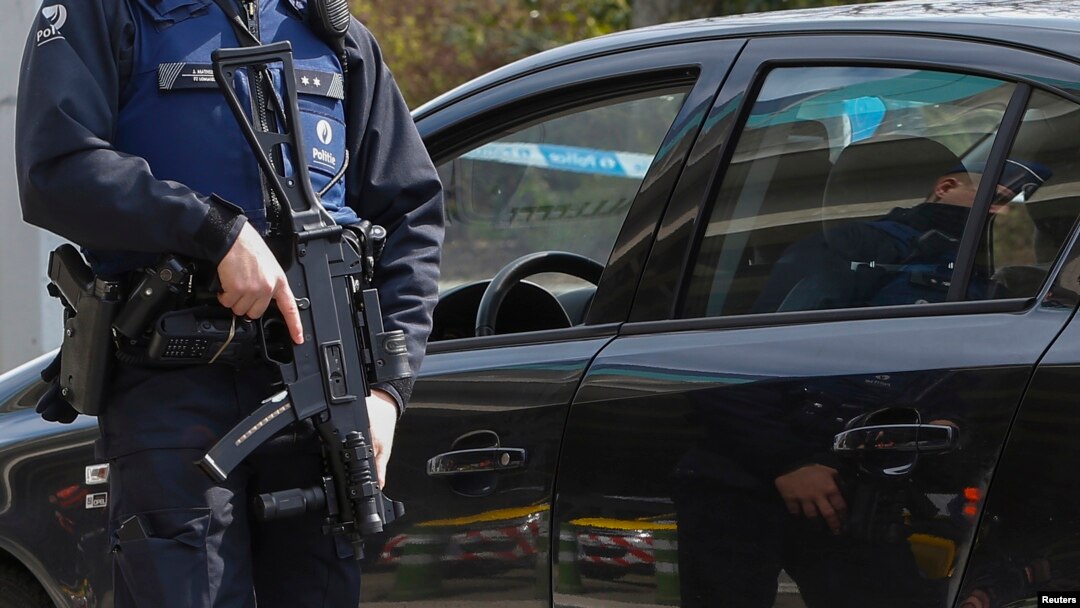 A Belgian police officer controls the access to Belgian international airport of Zaventem airport, which is still not operating, more than a week after the attacks in Brussels metro and the airport, in Zaventem, Belgium, April 1, 2016. 