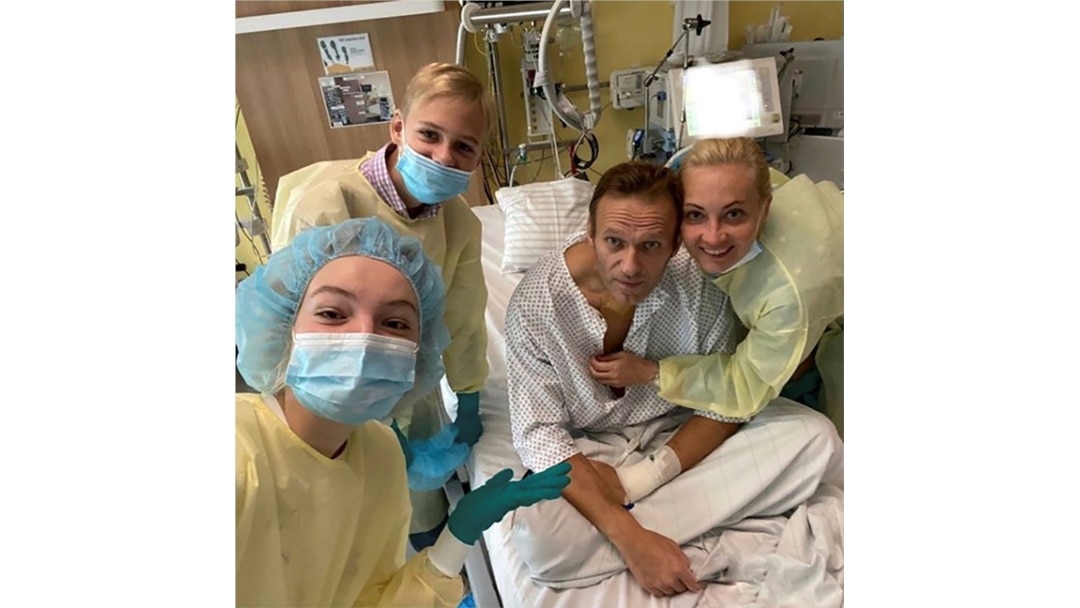Russian opposition politician Alexei Navalny and his family members pose for a picture at Charite hospital in Berlin, Germany, in this undated image obtained from social media September 15, 2020.