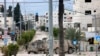 Israel ramps up West Bank offensive and says troops to remain in some areas 'for the coming year' 