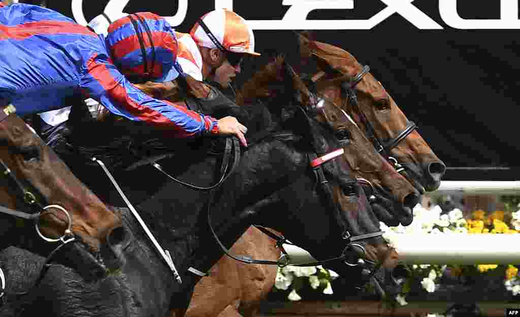 Jockey Craig Williams (R) onboard Vow and Declare wins the Melbourne Cup horse race in Melbourne, Australia.