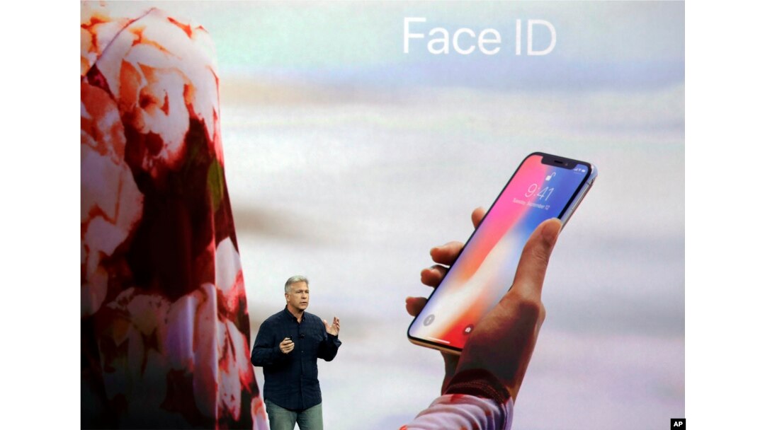 In this Tuesday, Sept. 12, 2017, file photo, Phil Schiller, Apple's senior vice president of worldwide marketing, announces features of the new iPhone X, including Face ID, at the new Apple campus in Cupertino, Calif. (AP Photo/Marcio Jose Sanchez, File)