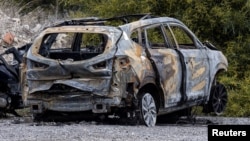 Zapaljeni automobil kojeg su navodno za bijeg koristili počinioci ubistva ruskog pilota Maksima Kuzminova, 14. februara 2024.