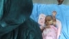 FILE - A child suffering from malnutrition is treated in Port Sudan during a visit by WHO Director-General Tedros Adhanom Ghebreyesus to Sudan, Sept. 7, 2024. According to the United Nations, 26 million people are in crisis levels of hunger across Sudan.