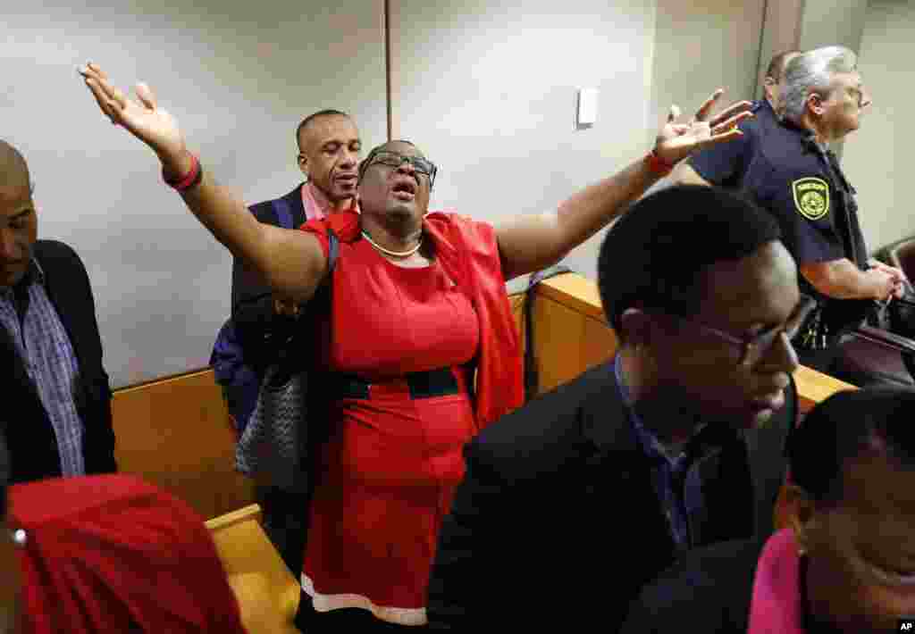 Botham Jean's mother, Allison Jean, rejoices in the courtroom after ex-police-officer Amber Guyger was found guilty of murder, in Dallas, Texas. Guyger shot and killed Botham Jean, an unarmed 26-year-old neighbor in his own apartment last year. She told police she thought his apartment was her own and that he was an intruder. (Image credit: Tom Fox/The Dallas Morning News)