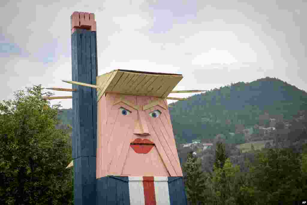 A wooden statue resembling Donald Trump is built near Kamnik, Slovenia.