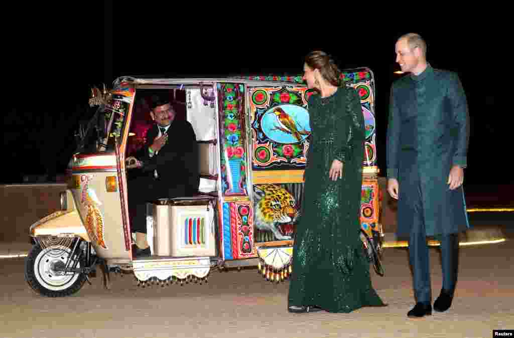 Britain's Prince William and Catherine, Duchess of Cambridge, arrive by Tuk Tuk to attend a reception hosted by the British High Commissioner to Pakistan, Thomas Drew, at the Pakistan National Monument in Islamabad.