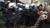 Protesters scuffle with police in Serbia as they demand arrests over a deadly roof collapse 