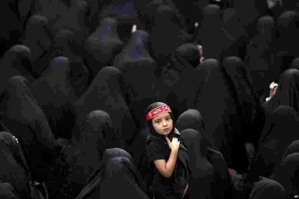 Muslim Shi'ite women attend a mourning ceremony five days ahead of Ashoura, at the Sadat Akhavi Mosque in Tehran, Iran.