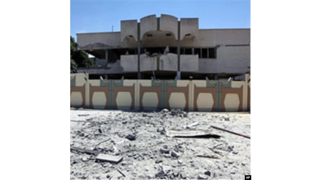 A picture taken during a government-guided tour on May 12, 2011 shows a damaged building in Bab al-Aziziya in Tripoli, following NATO air strikes on Libyan leader Moammer Gadhafi's compound