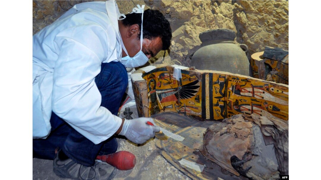 Egyptian archaeologists have discovered six mummies, colourful wooden coffins and more than 1,000 funerary statues in the 3,500-year-old tomb, the antiquities ministry said.