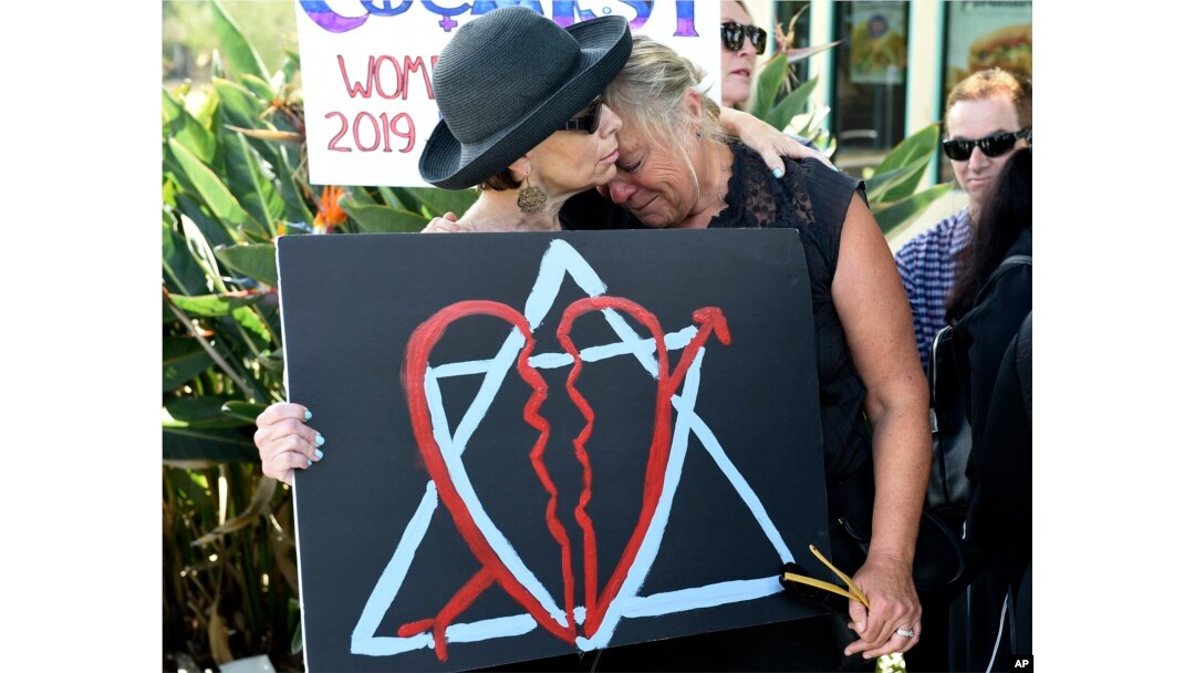 Leslie Gollub, left, and Gretchen Gordon hug at a vigil held to support the victims of Saturday's shooting at Chabad of Poway synagogue, Sunday, April 28, 2019, in Poway, Calif.