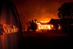 Flames from the Kincade Fire consume Soda Rock Winery, Oct 27, 2019, in Healdsburg, California.