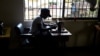 FILE - A victim of human trafficking in Libya sews clothes in Benin, Edo State, Nigeria, Oct. 21, 2016. Human Rights Watch says in a new report that Nigerian trafficking survivors are not getting enough support from their government.
