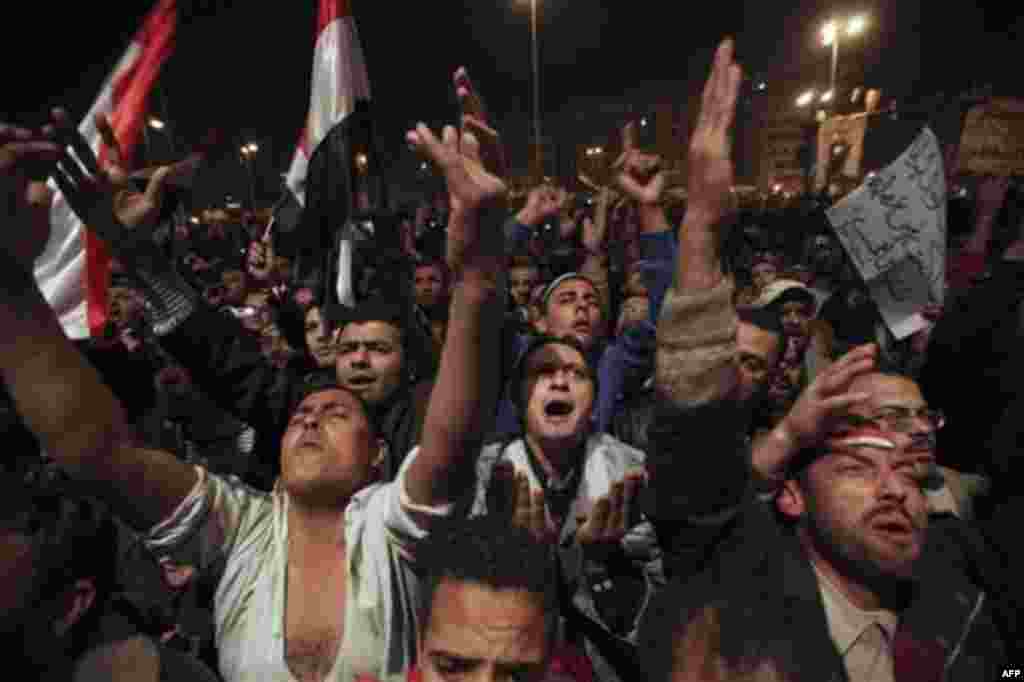 Anti-government protesters demonstrate prior to the televised speech of Egyptian President Hosni Mubarak, in which they believed he would step down, at the continuing anti-government demonstration in Cairo, Egypt Thursday, Feb. 10, 2011. Mubarak refused