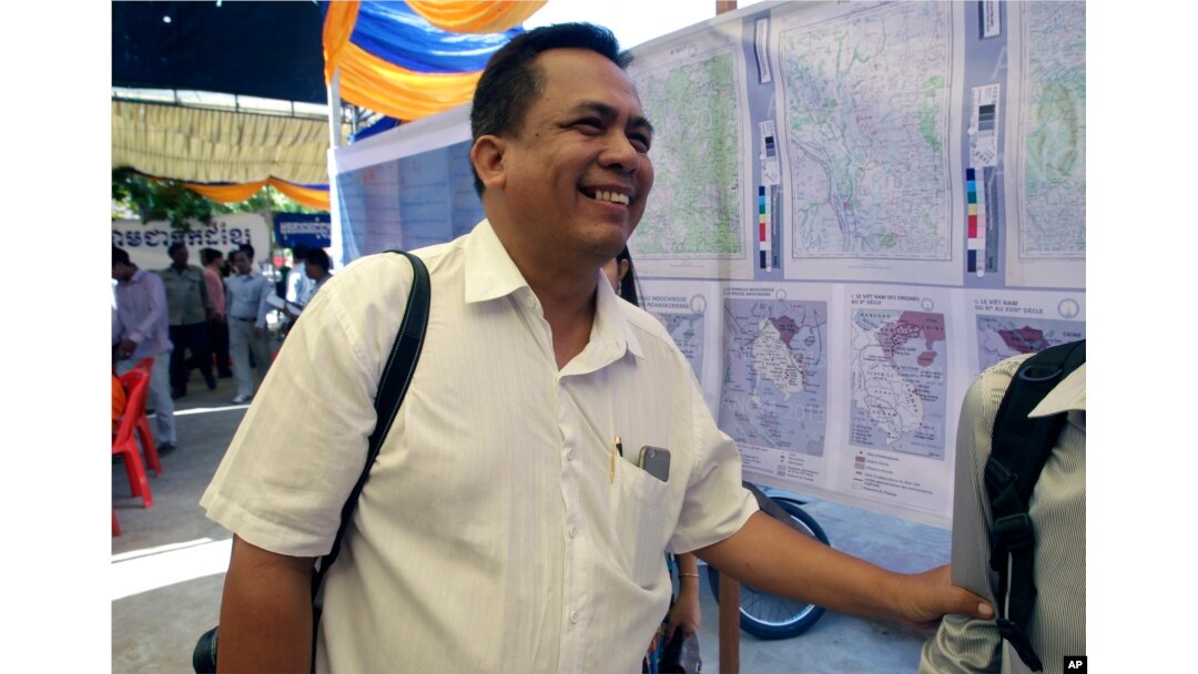 FILE - Political analyst Kem Ley smiles as he celebrated the 67th anniversary to commemorate the Kampuchea Krom territory's return to Vietnam by the French government, at Chroy Changvar, in Phnom Penh, Cambodia, June 4, 2016.