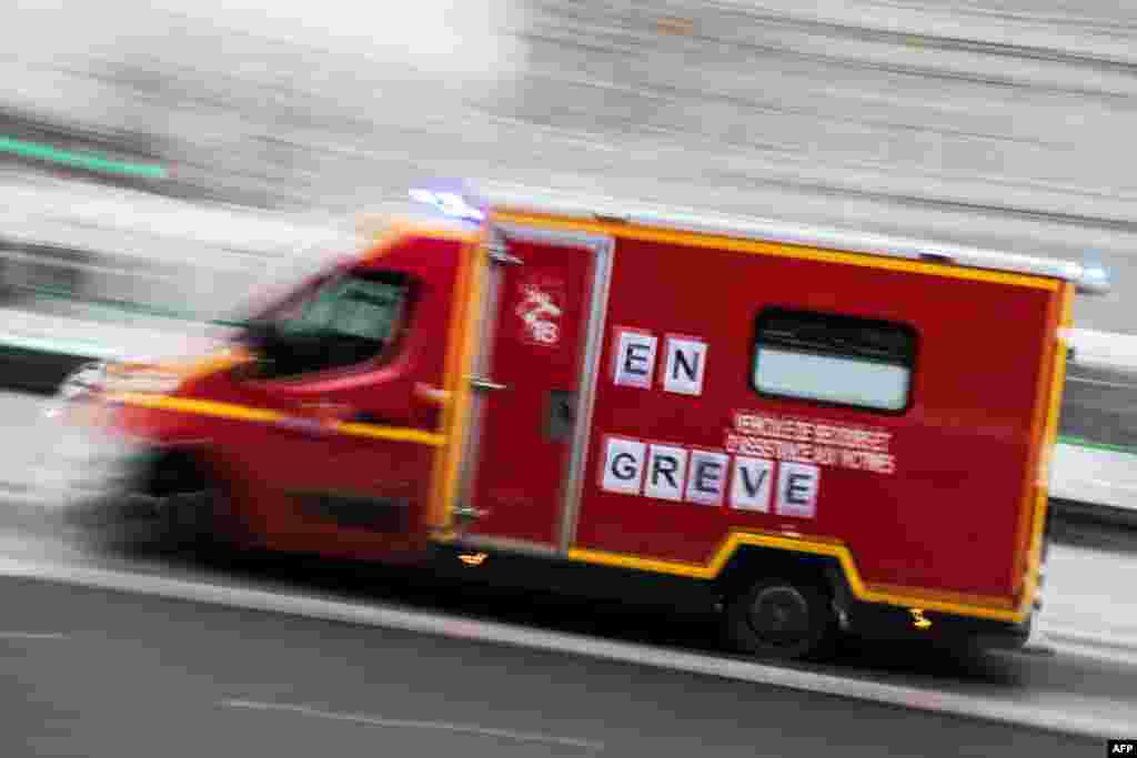 A firemen truck reading "on strike" runs in Nantes, France.