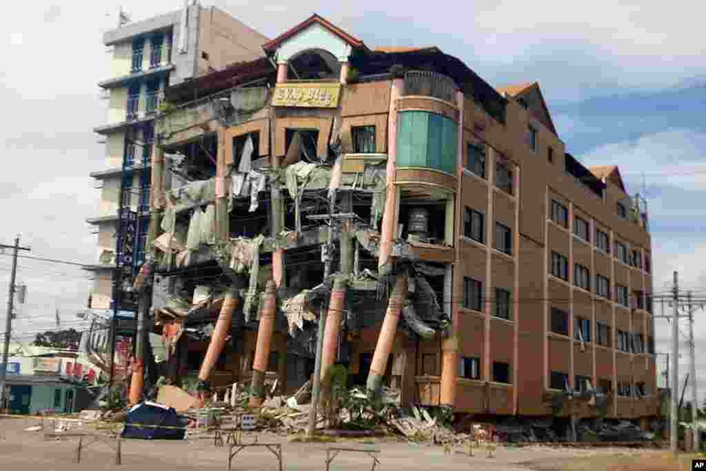 Eva's Hotel stands damaged after a strong earthquake in Kidapawan, north Cotabato province, Philippines.