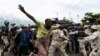 Protesters gather outside parliament in Port-au-Prince to press for progress on impeachment of the president. (M. Vilme/VOA))