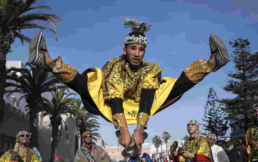 A Gnawa traditional group performs in the city of Essaouira, Dec. 14, 2019, to celebrate the decision of adding the Gnawa culture to UNESCO&#39;s list of Intangible Cultural Heritage of Humanity.