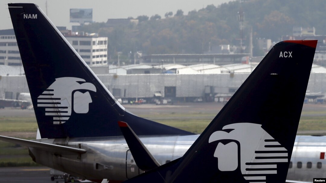 FILE - Aeromexico aeroplanes are seen on the airstrip at Benito Juarez international airport in Mexico City, July 8, 2015.