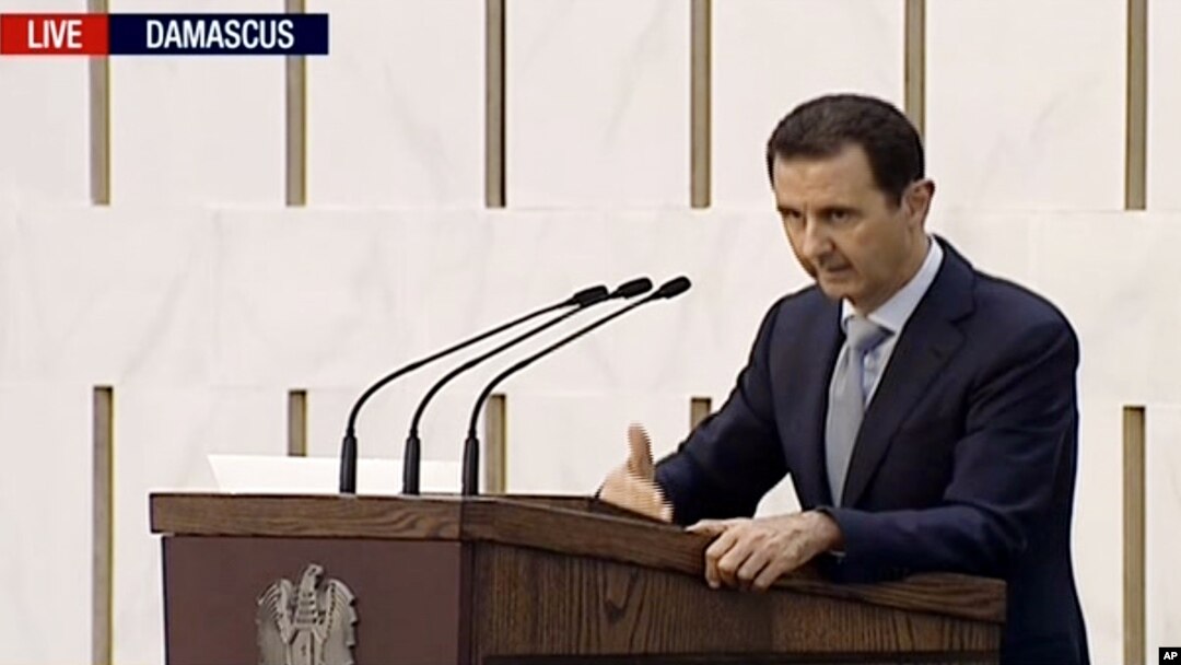 Syrian President Bashar Assad delivering a speech in Damascus, Syria, Sunday. This image is made from video broadcast on Press TV, Iran's English language state-run channel, July 26, 2015.