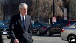 FILE - Special Counsel Robert Mueller walks to his car across from the White House, in Washington, March 24, 2019.