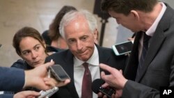 FILE - Senate Foreign Relations Committee Chairman Sen. Bob Corker, R-Tenn. is surrounded by reporters on Capitol Hill in Washington, May 16, 2017.
