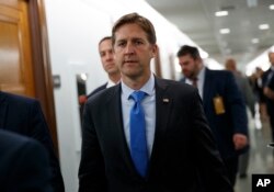 FILE - Sen. Ben Sasse, R-Nebraska, returns to a Senate Judiciary Committee hearing after a break on Capitol Hill in Washington, Sept. 27, 2018.