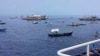 Philippine activists sail towards reef at heart of maritime dispute with China