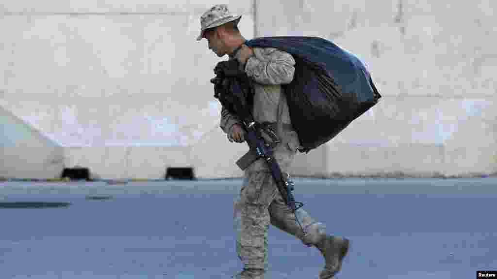 A U.S. Marine is pictured before their withdrawal from the base, at Camp Bastion in Helmand province, Oct. 25, 2014.