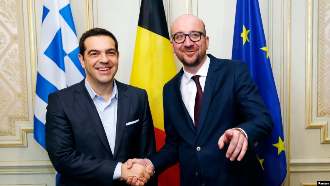 Belgian Prime Minister Charles Michel poses with his Greek counterpart Alexis Tsipras (L) ahead of a meeting in Brussels, Feb. 12, 2015.