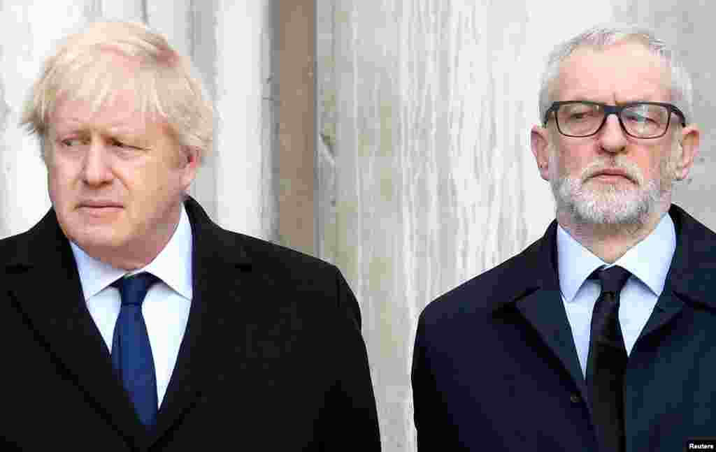 Britain's Prime Minister Boris Johnson and opposition Labour Party leader Jeremy Corbyn attend a vigil for victims of a fatal attack on London Bridge.