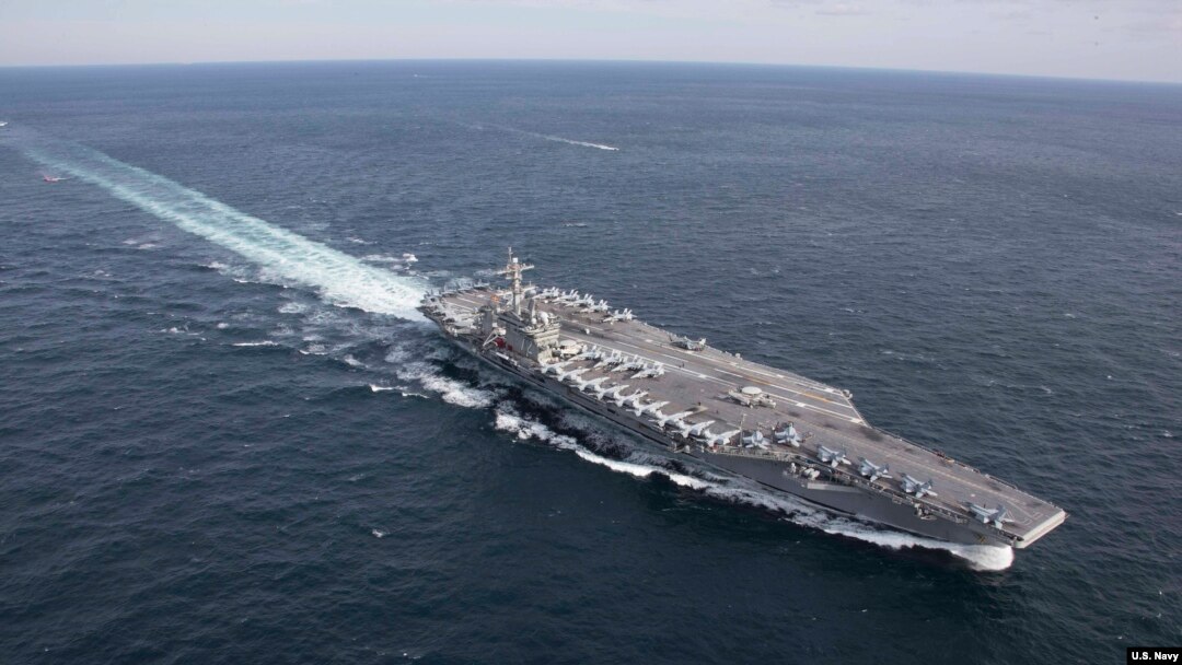 FILE - The Nimitz-class aircraft carrier USS Abraham Lincoln transits the Atlantic Ocean during a strait transit exercise, Jan. 30, 2019.
